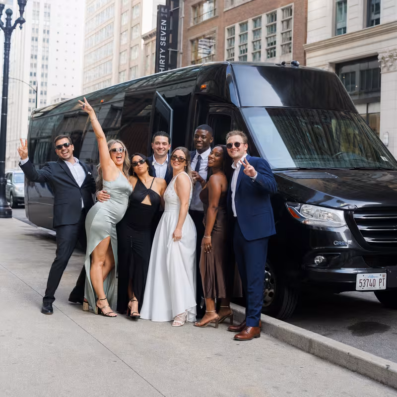 Group boarding a white charter bus for Bachelor & Bachelorette Transportation transportation in Chicago