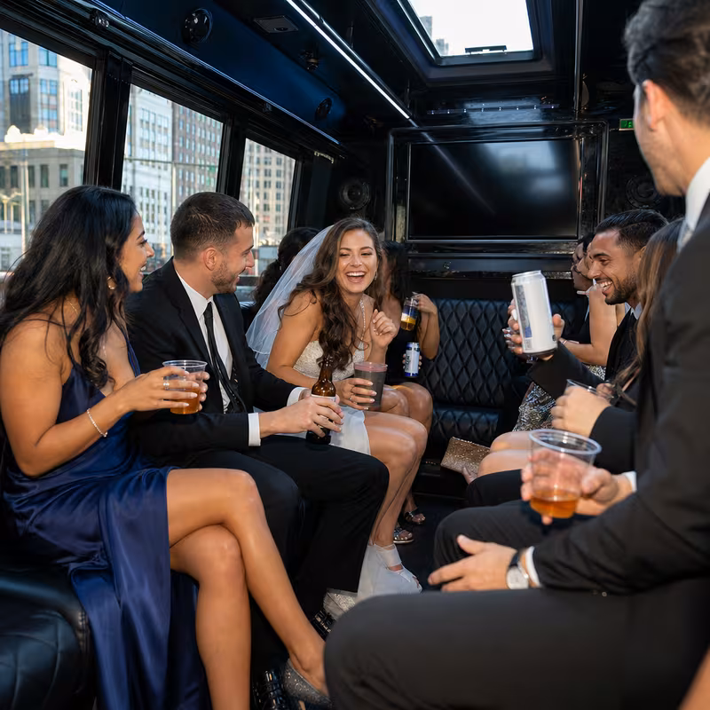 Party bus interior with wraparound leather seating and LED lighting in Chicago