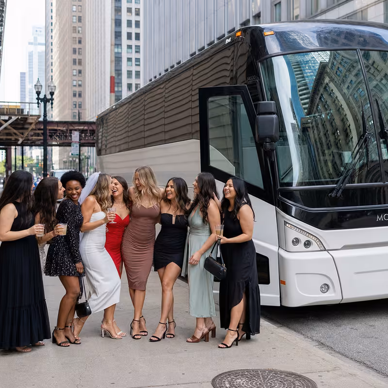 Passengers loading luggage while boarding an Chicago group shuttle
