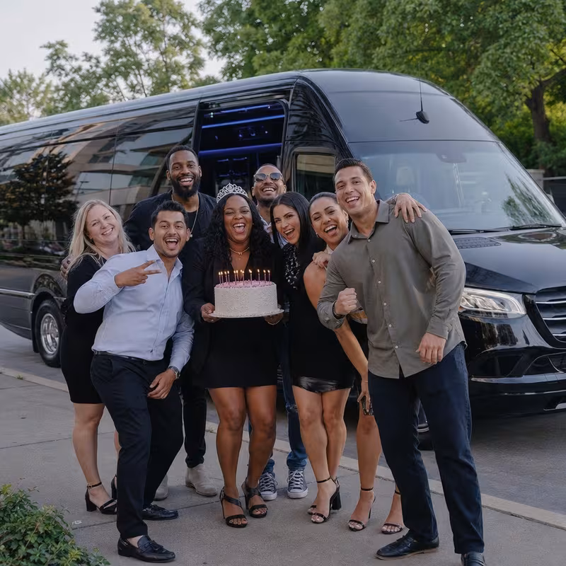 Group boarding a white charter bus for Birthday Transportation transportation in Chicago