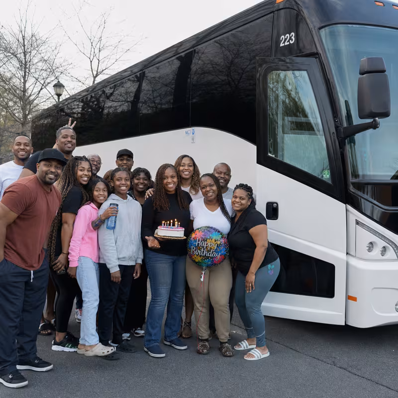 Passengers loading luggage while boarding an Chicago group shuttle
