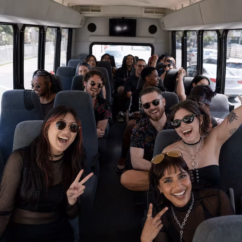 Party bus interior with wraparound leather seating and LED lighting in Chicago