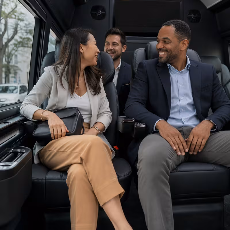 Group boarding a white charter bus for Corporate Transportation transportation in Chicago