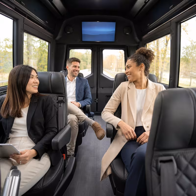 Passengers loading luggage while boarding an Chicago group shuttle