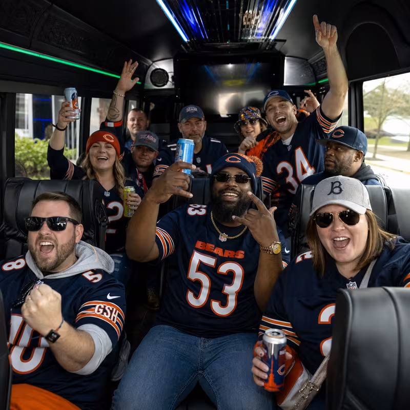 Group boarding a white charter bus for Sporting Event Transportation transportation in Chicago