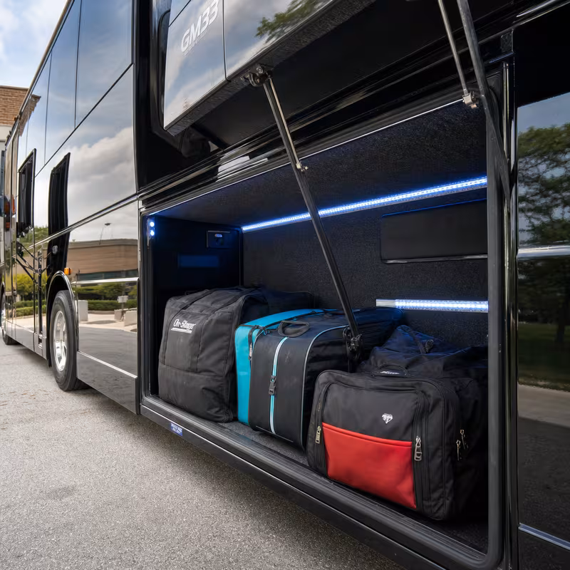 Party bus interior with wraparound leather seating and LED lighting in Chicago