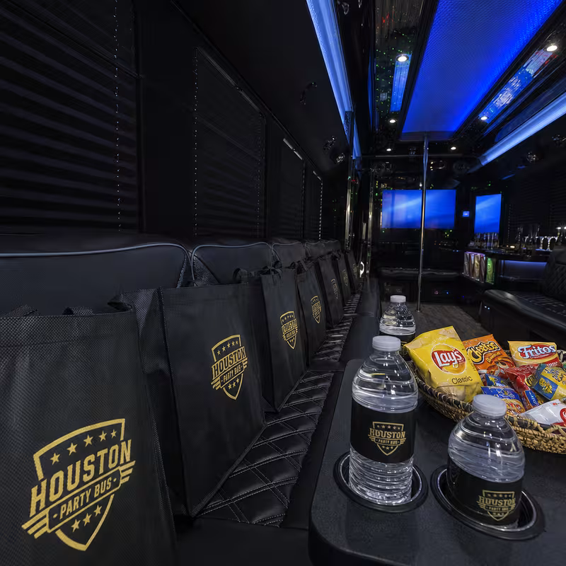 Party bus interior with wraparound leather seating and LED lighting in Chicago
